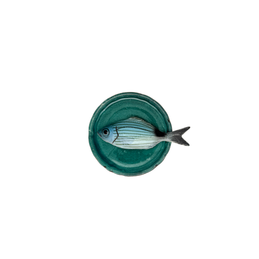 Occhiata piccolo op een handgemaakt turquoise bordje, 10.5cm